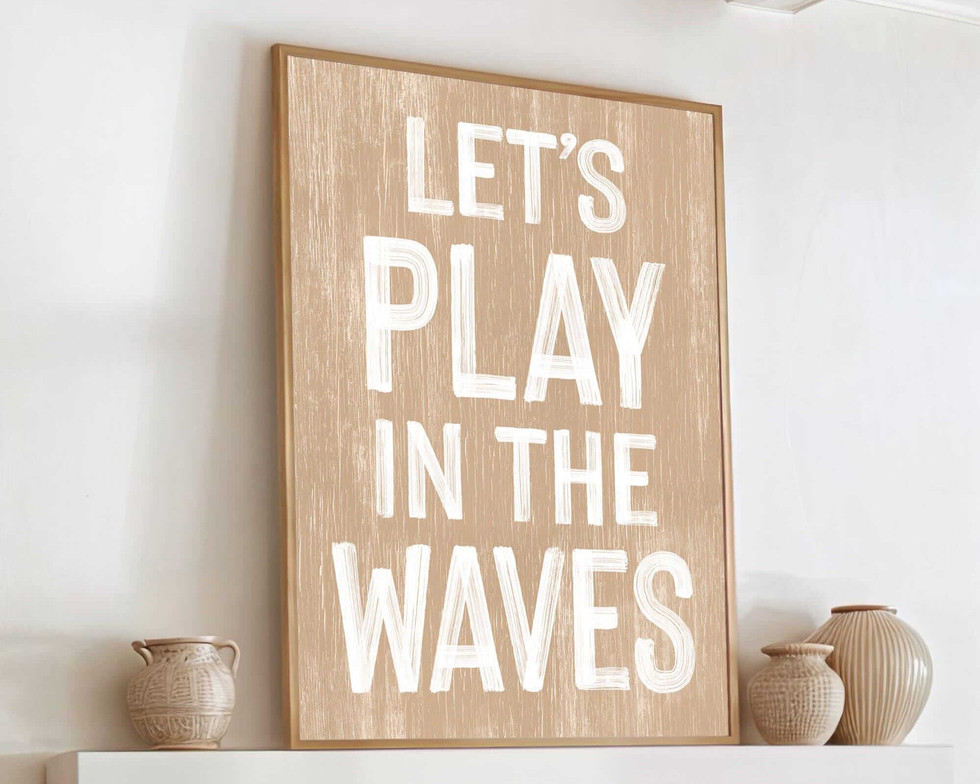 a wooden sign that says let's play in the waves