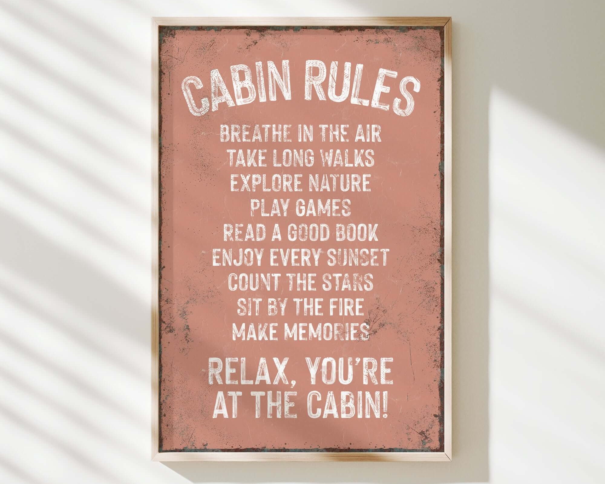 a sign that reads cabin rules hanging on a wall