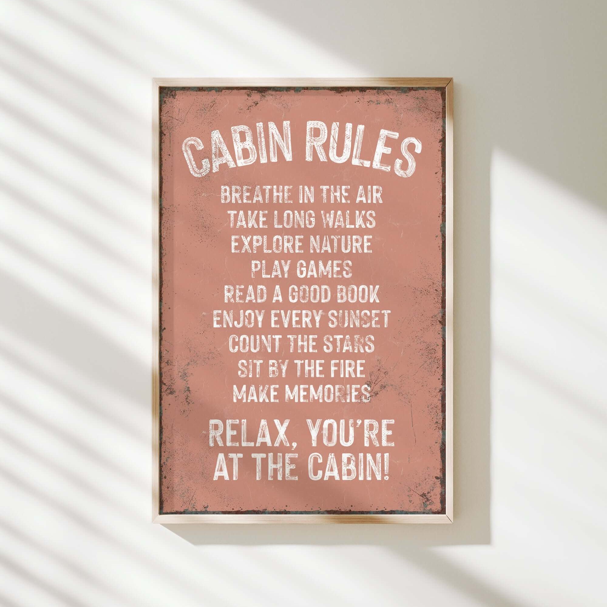 a sign that reads cabin rules hanging on a wall