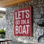 a sign that says let&#39;s go on a boat on a stone wall