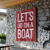 a sign that says let&#39;s go on a boat on a stone wall