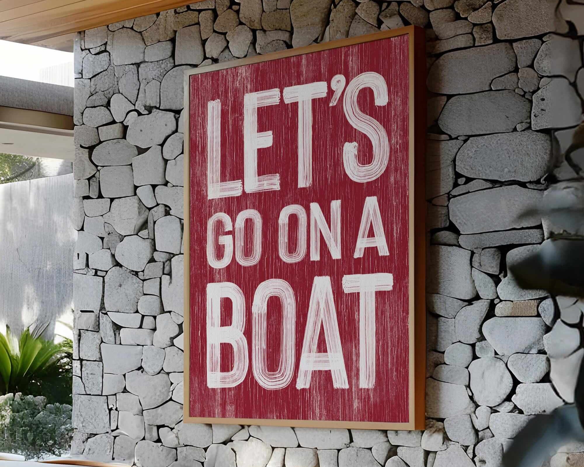 a sign that says let's go on a boat on a stone wall
