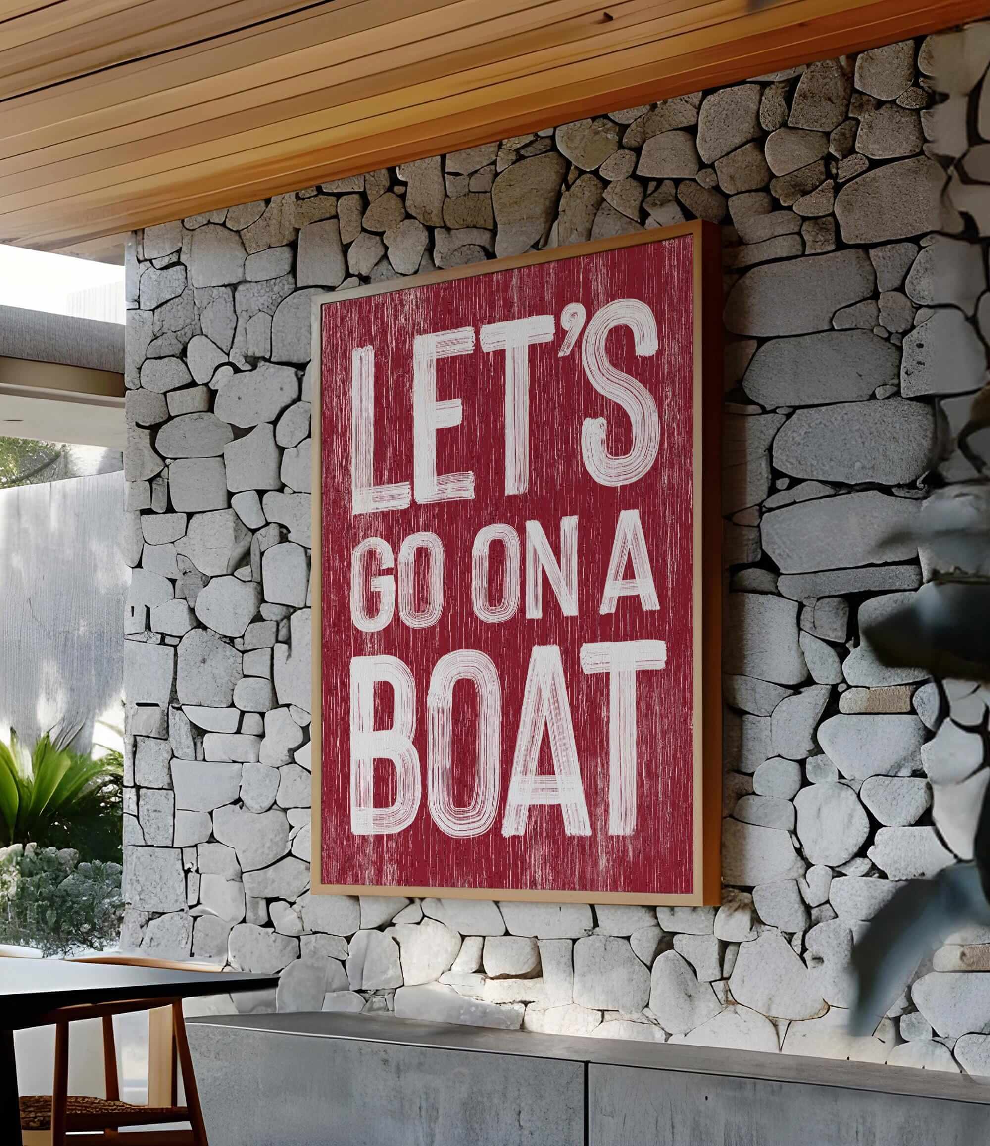 a sign that says let&#39;s go on a boat on a stone wall