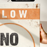 a hand holding a sign that says slow no wave