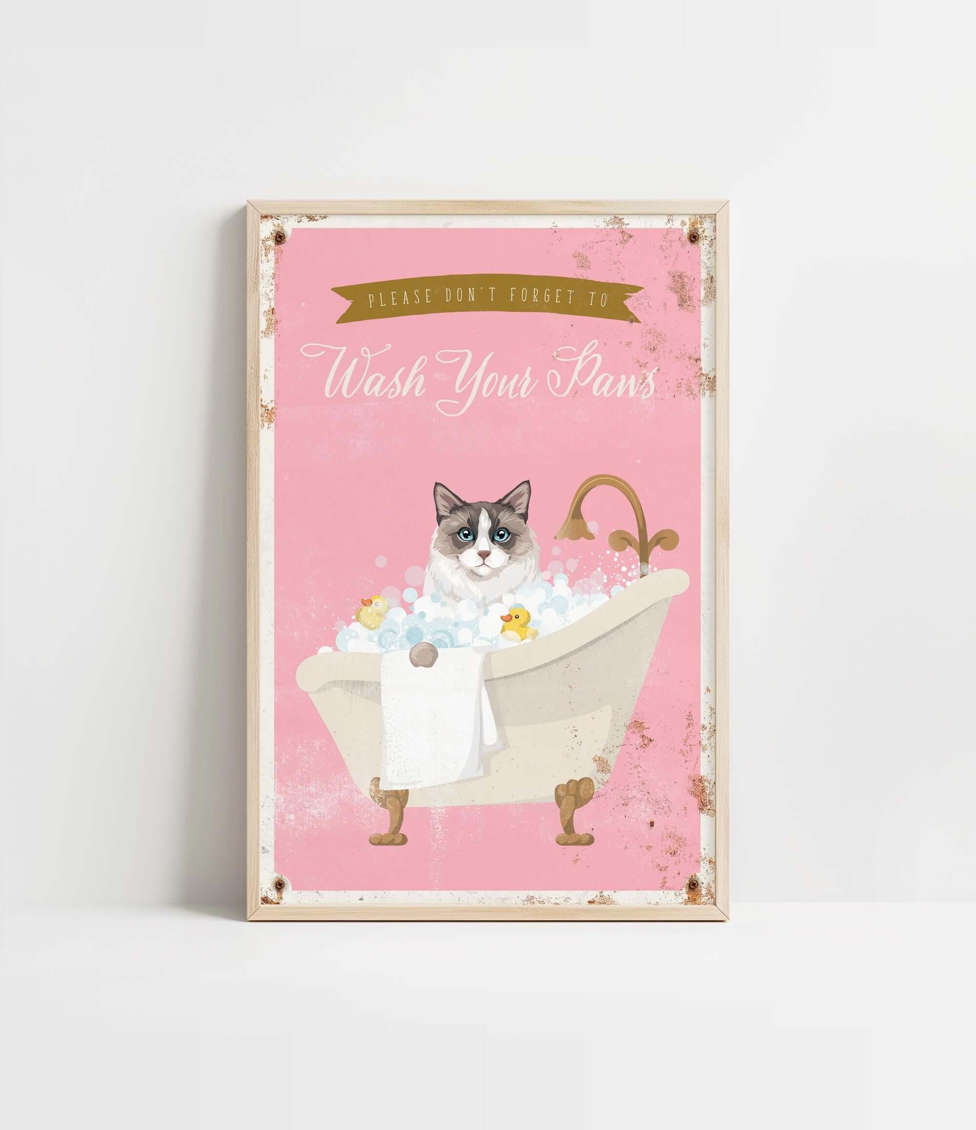 A framed poster with a cat sitting in a bathtub filled with bubbles, accompanied by the text "Please don't forget to wash your pans".