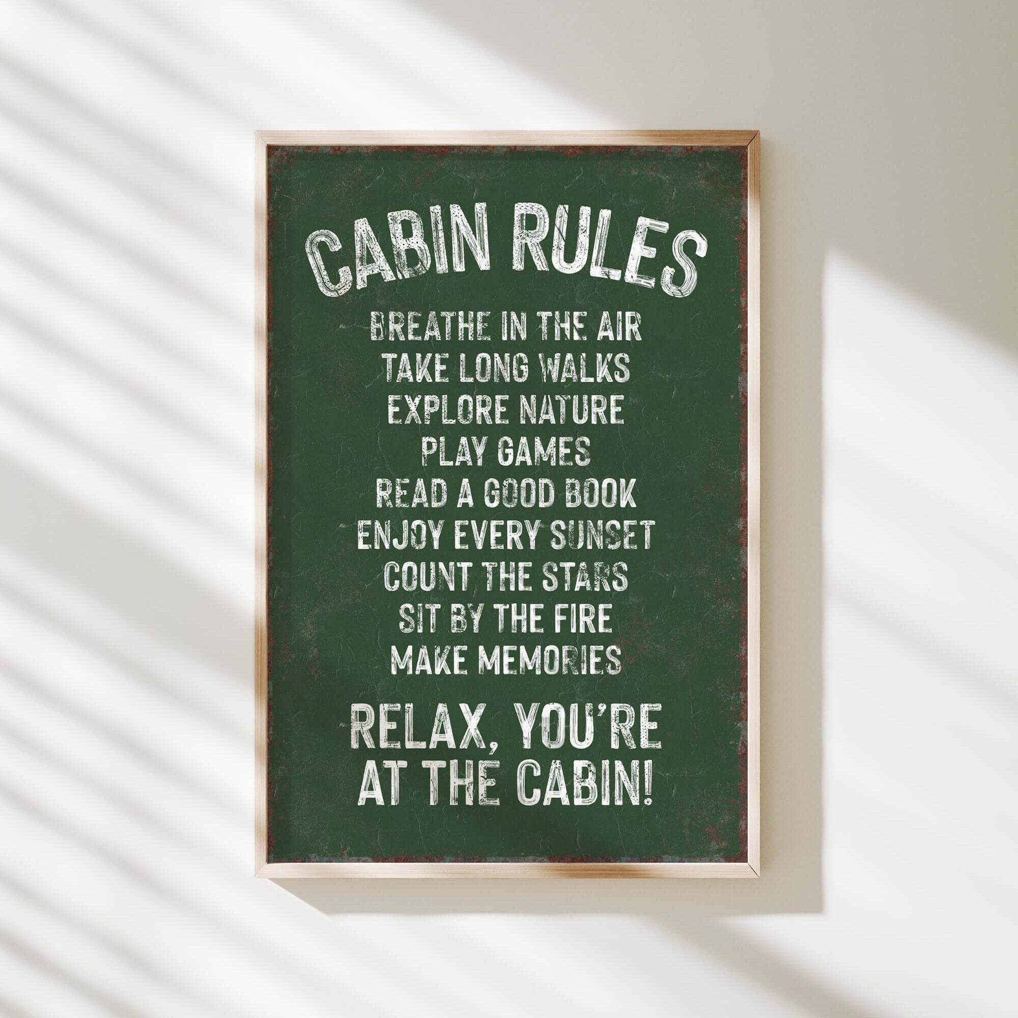 a green sign hanging on the side of a wall