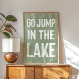 a green sign that says go jump in the lake