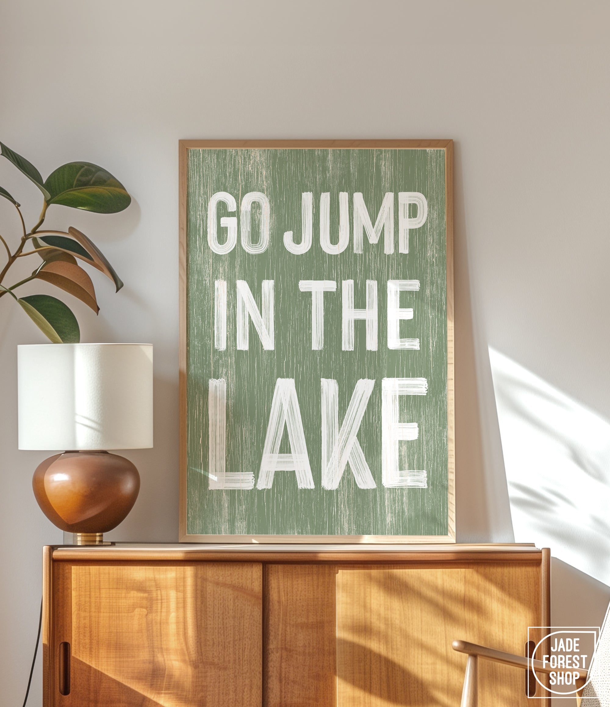 a green sign that says go jump in the lake