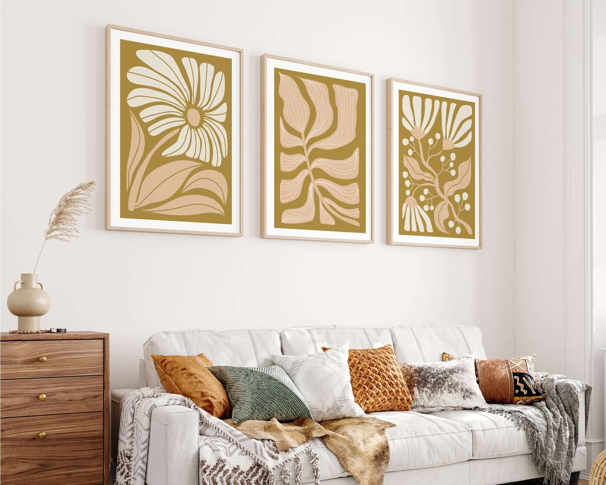Neutral-toned living room with a white sofa, decorative pillows, and the Flower Blocks Triptych | Set of Three Prints | 008—abstract floral wall art perfect for elevating your home decor.