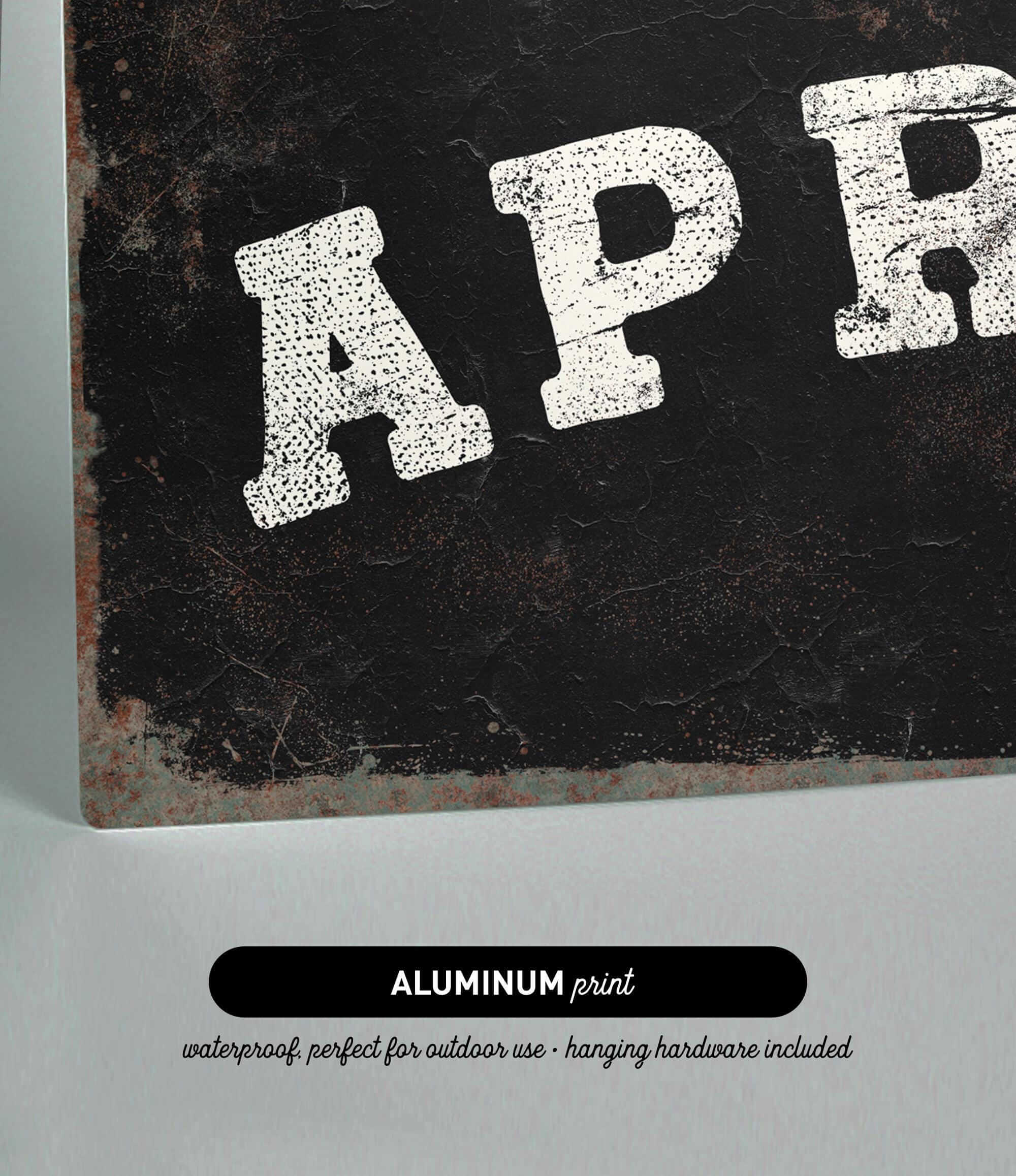 The image is an aluminum print with the text "APR" in white letters on a black background.