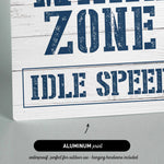 a wooden sign that says wake zone idle speed