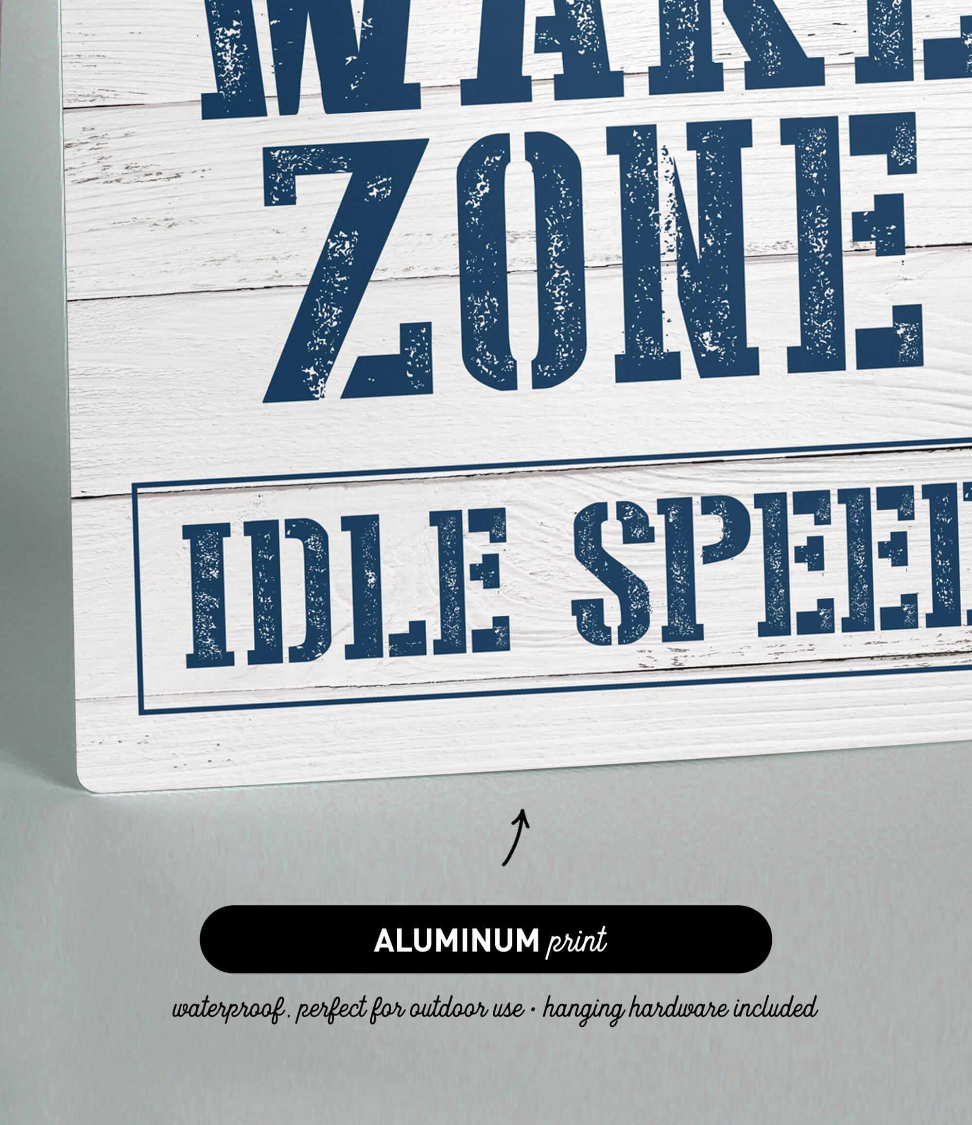 a wooden sign that says wake zone idle speed