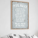 a bedroom with a bed and a poster on the wall