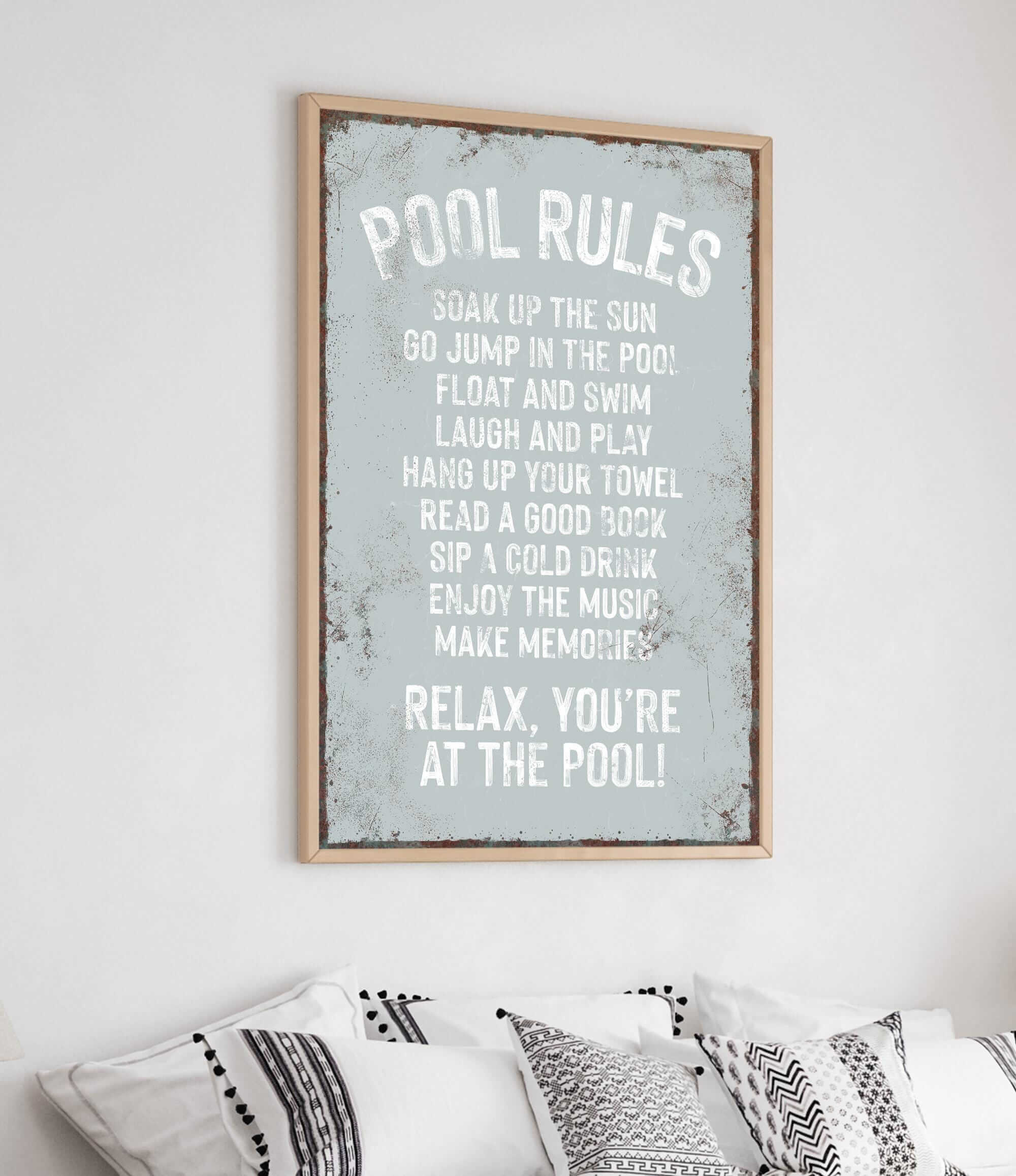 a bedroom with a bed and a poster on the wall