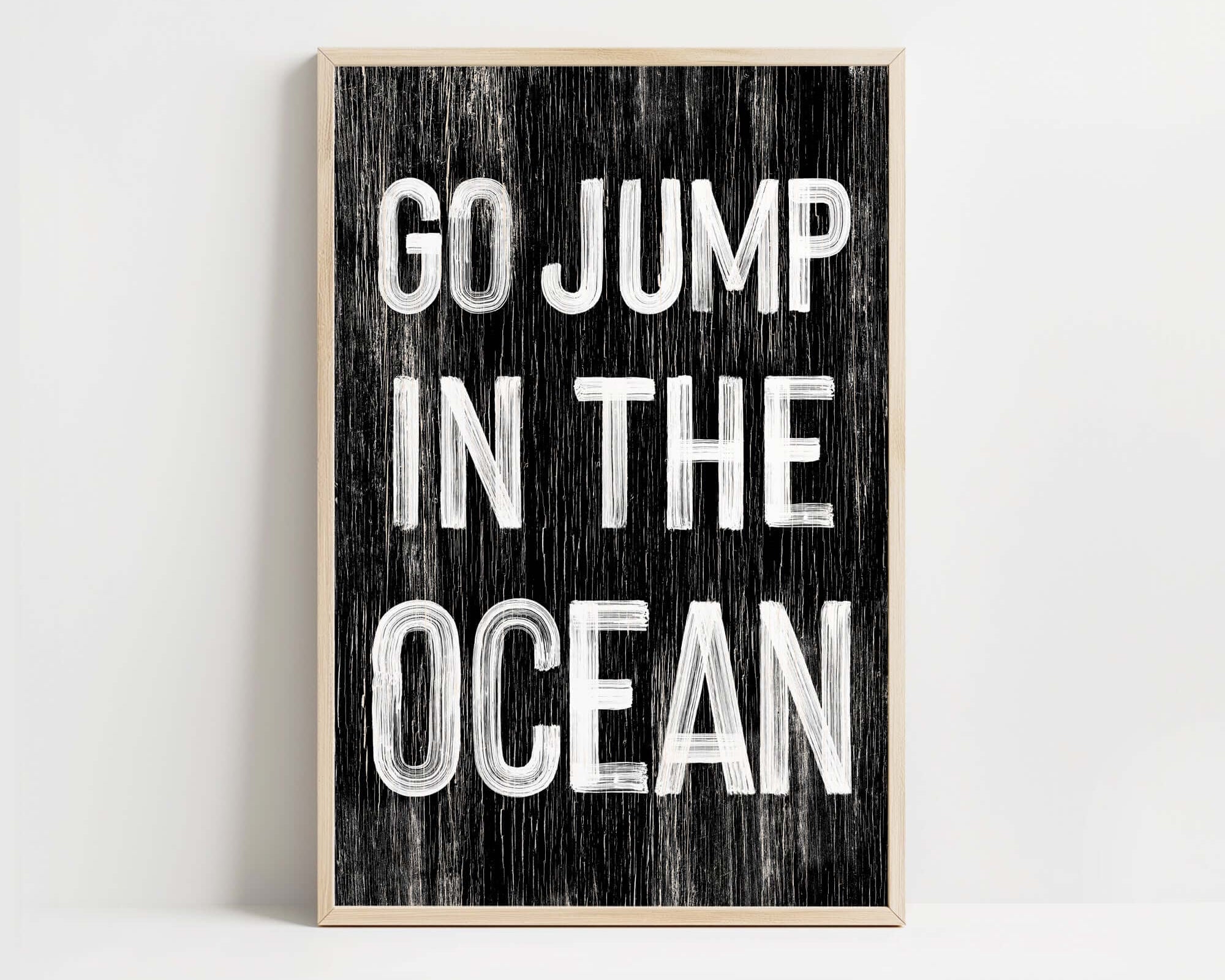 a black and white poster with the words go jump in the ocean