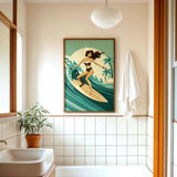 a bathroom with a framed illustration of a woman surfing on a wave, a potted plant, a sink, and a towel.