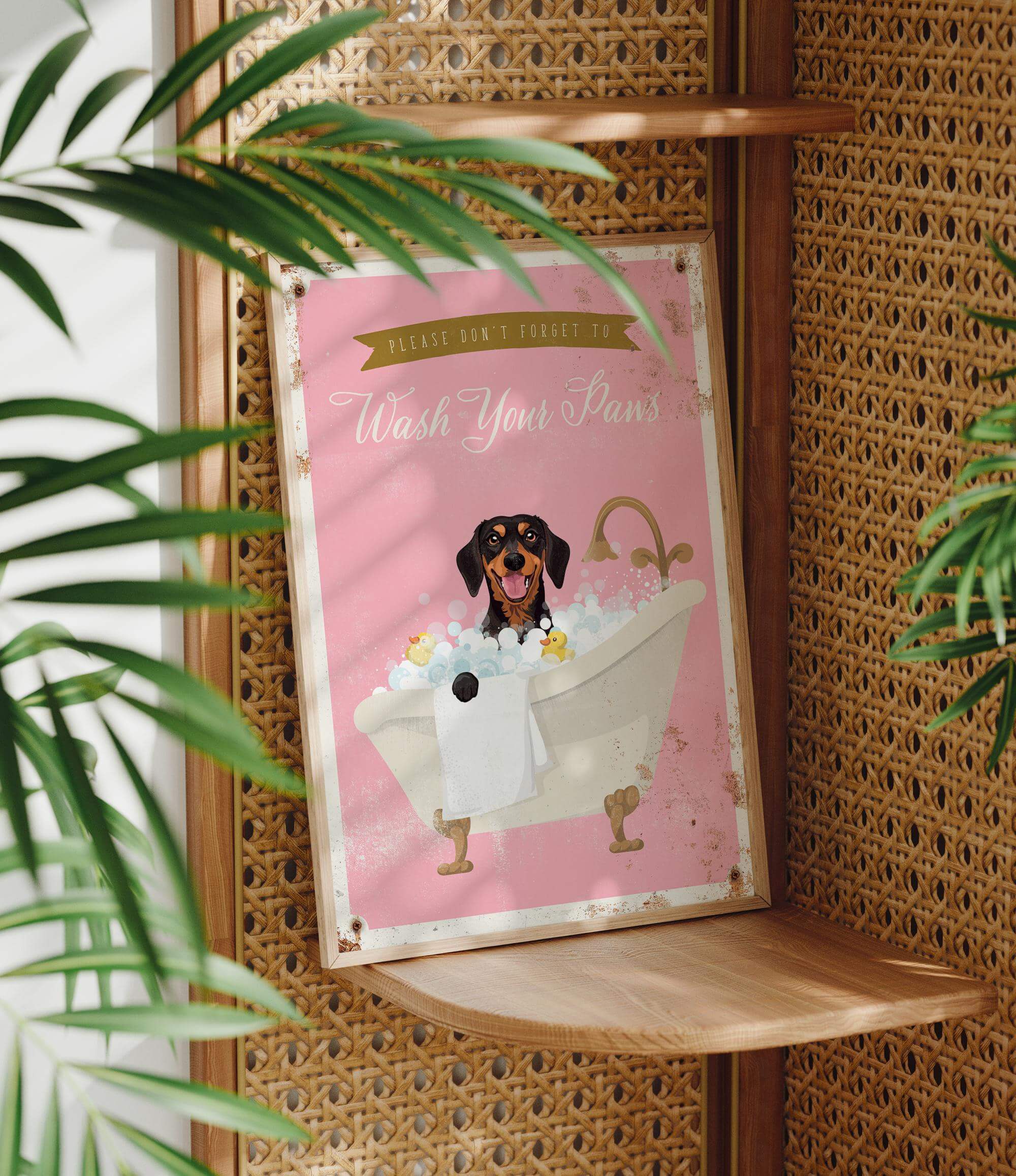 A pink sign with a dog sitting in a bathtub, surrounded by bubbles, and the text "Please don't forget to wash your paws" is displayed on a wooden shelf.