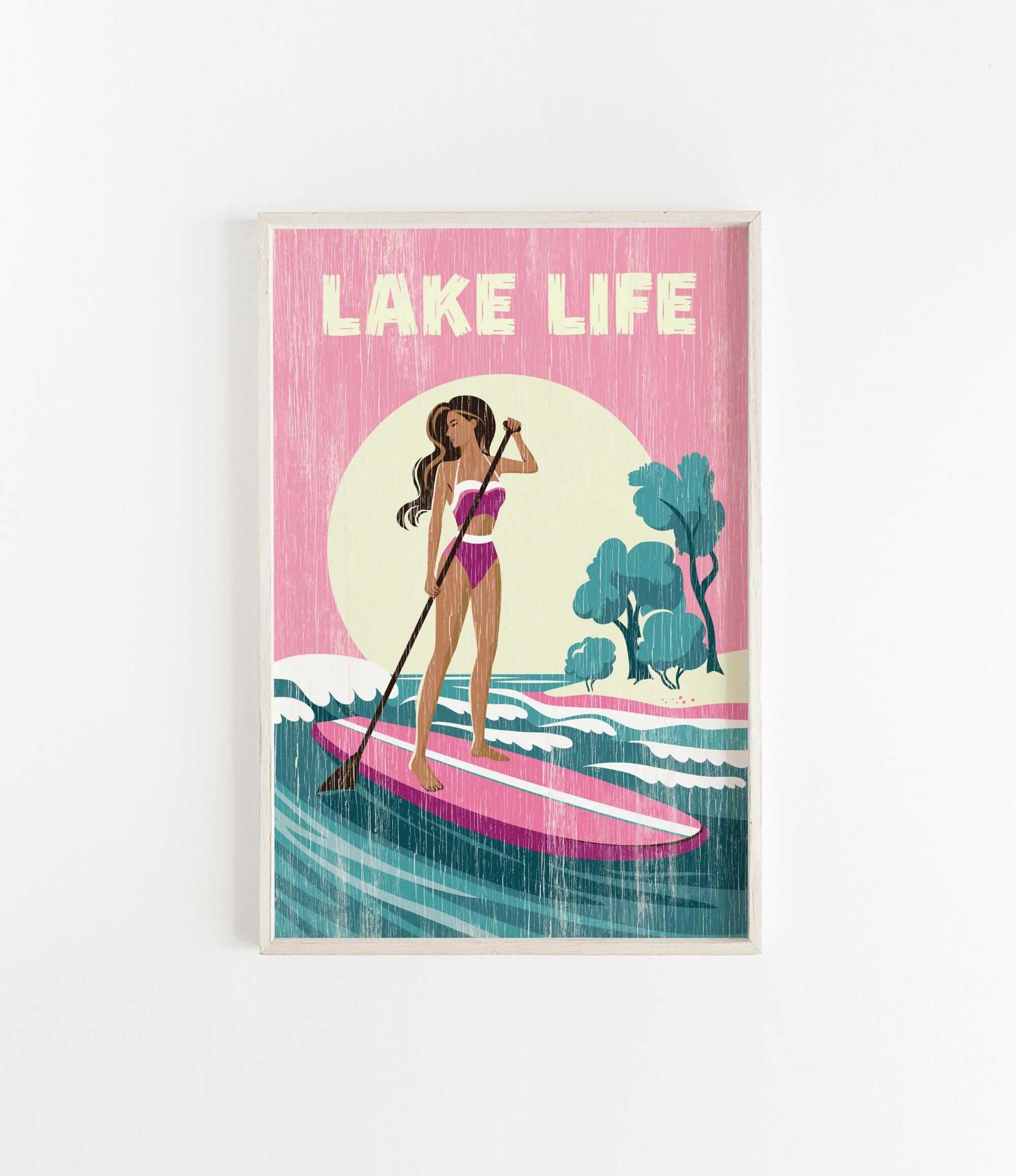 A woman in a pink swimsuit is paddleboarding on a pink surfboard, with a sunset and trees in the background.