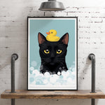 A framed illustration of a black cat with a yellow rubber duck on its head, set against a blue background with white bubbles.