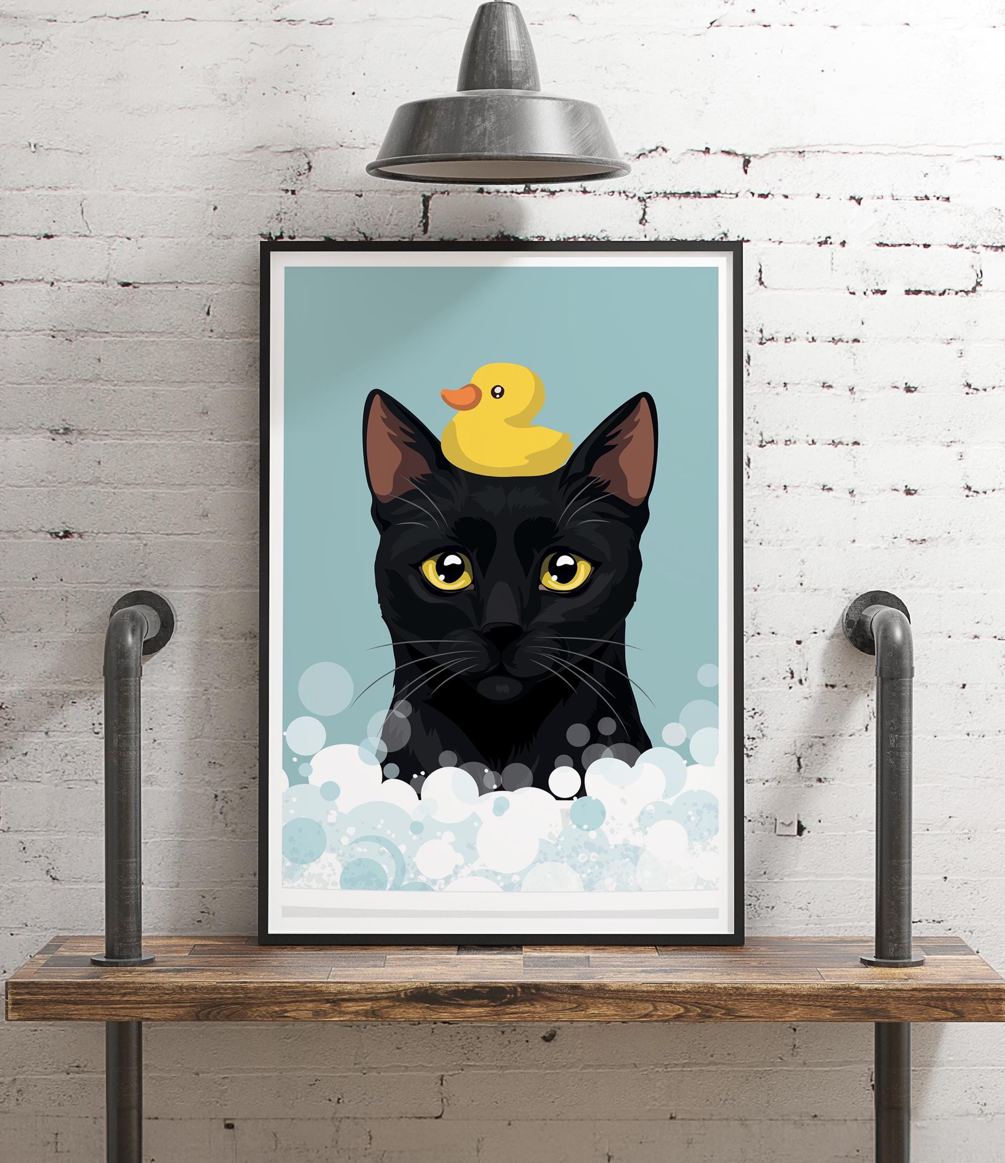 A framed illustration of a black cat with a yellow rubber duck on its head, set against a blue background with white bubbles.