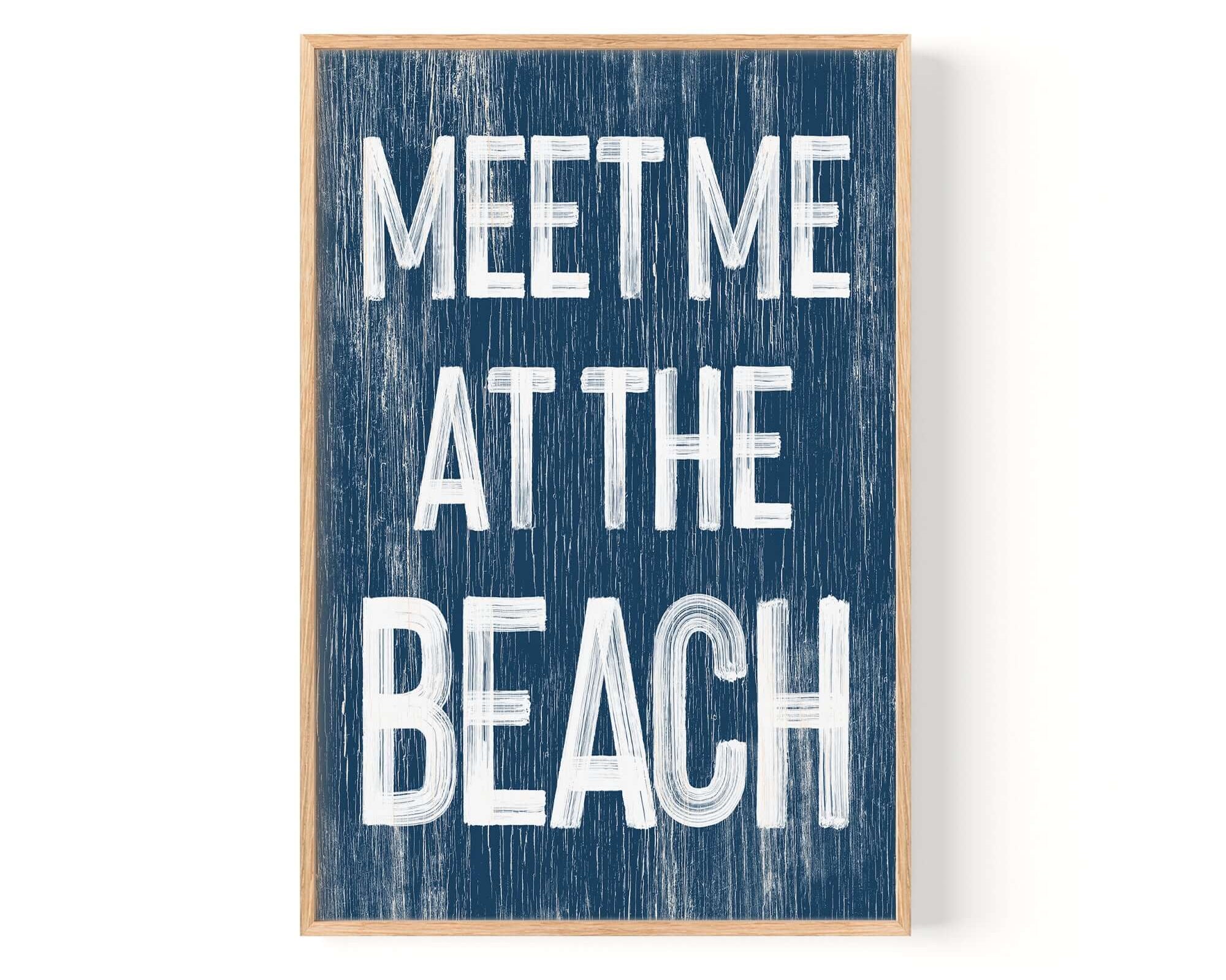 a wooden sign that says meet me at the beach
