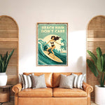 a vintage poster of a woman surfing with the text "BEACH HAIR DON'T CARE" displayed above her. The poster is hanging on a wall above a brown leather couch with striped pillows.