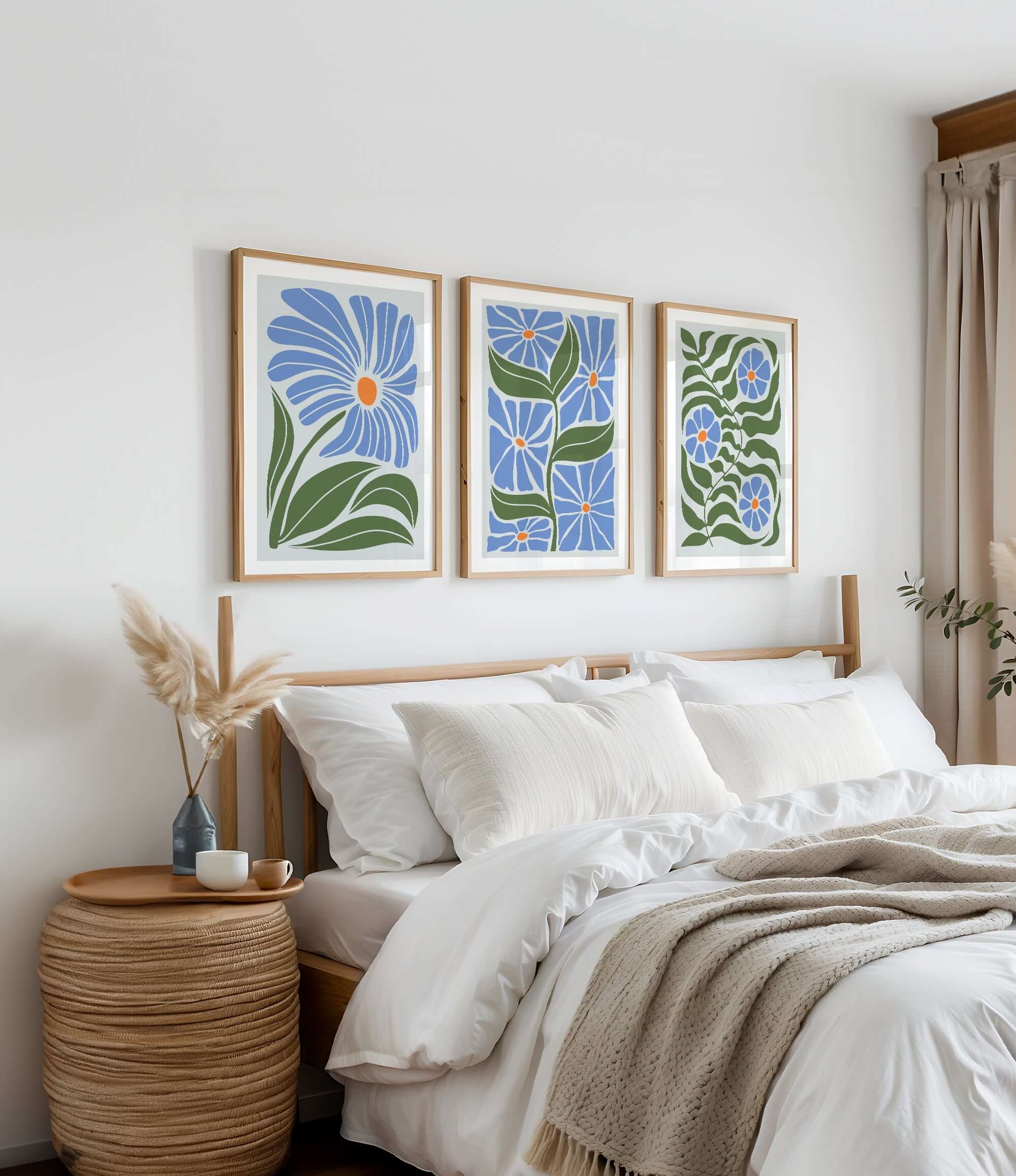 a bedroom with a bed and two paintings on the wall