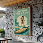 A framed poster with a woman paddleboarding on a lake, with the text "LAKE HAIR DON'T CARE" displayed prominently.