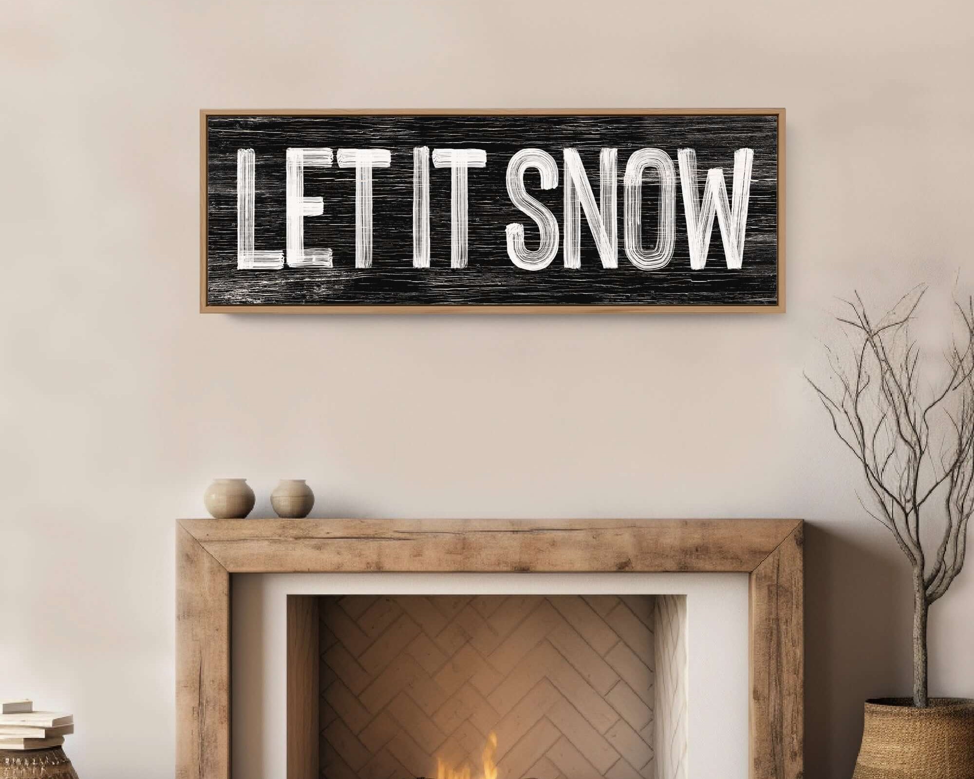 a fireplace with a sign that says let it snow