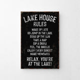 a sign on a wall that says lake house rules