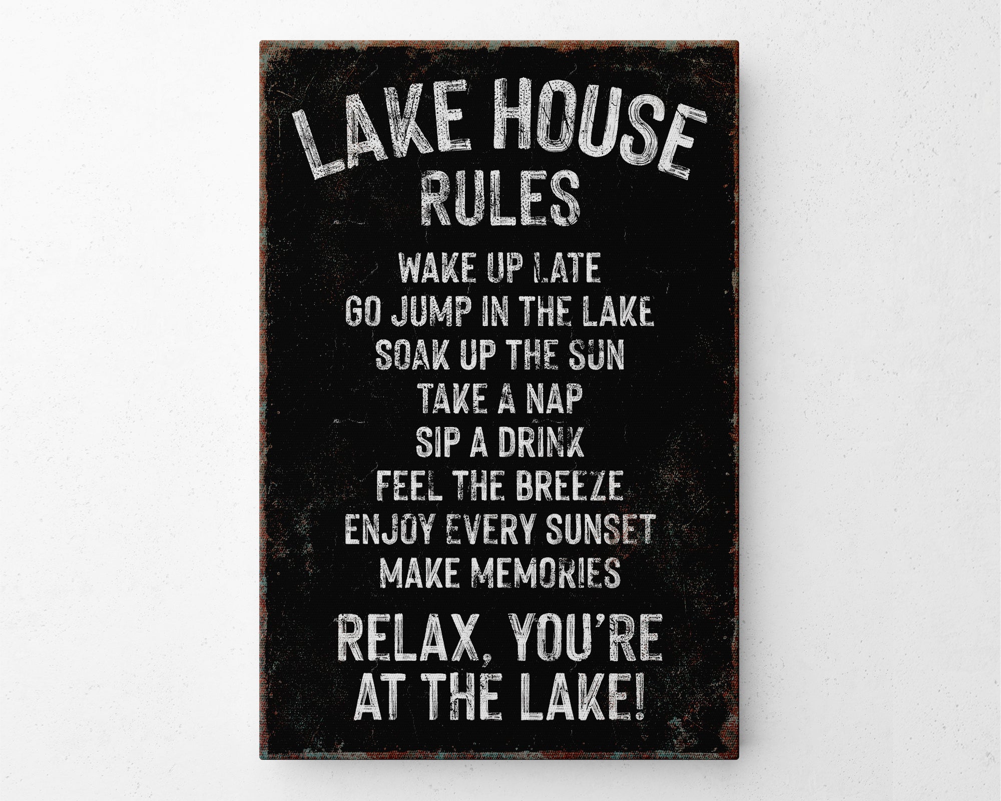 a sign on a wall that says lake house rules