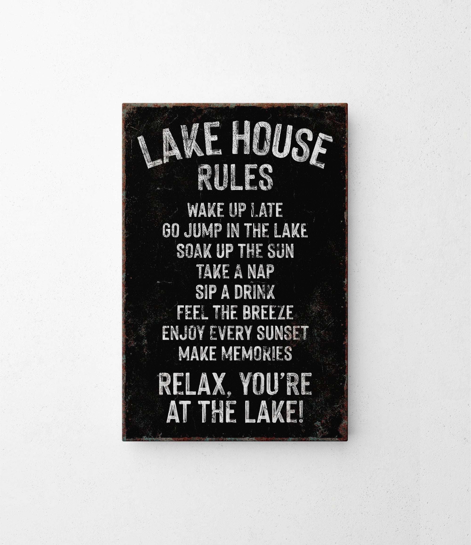 a sign on a wall that says lake house rules