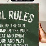a hand holding a sign that says pool rules