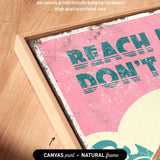 The image is a framed artwork featuring a vibrant pink and teal design with the text "REACH DON'T" prominently displayed.