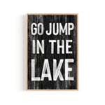 a black and white sign that says go jump in the lake