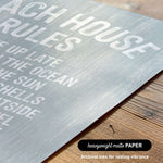 The image is a close-up of a textured grey surface with bold white text that reads "ACHIEVING RULES".