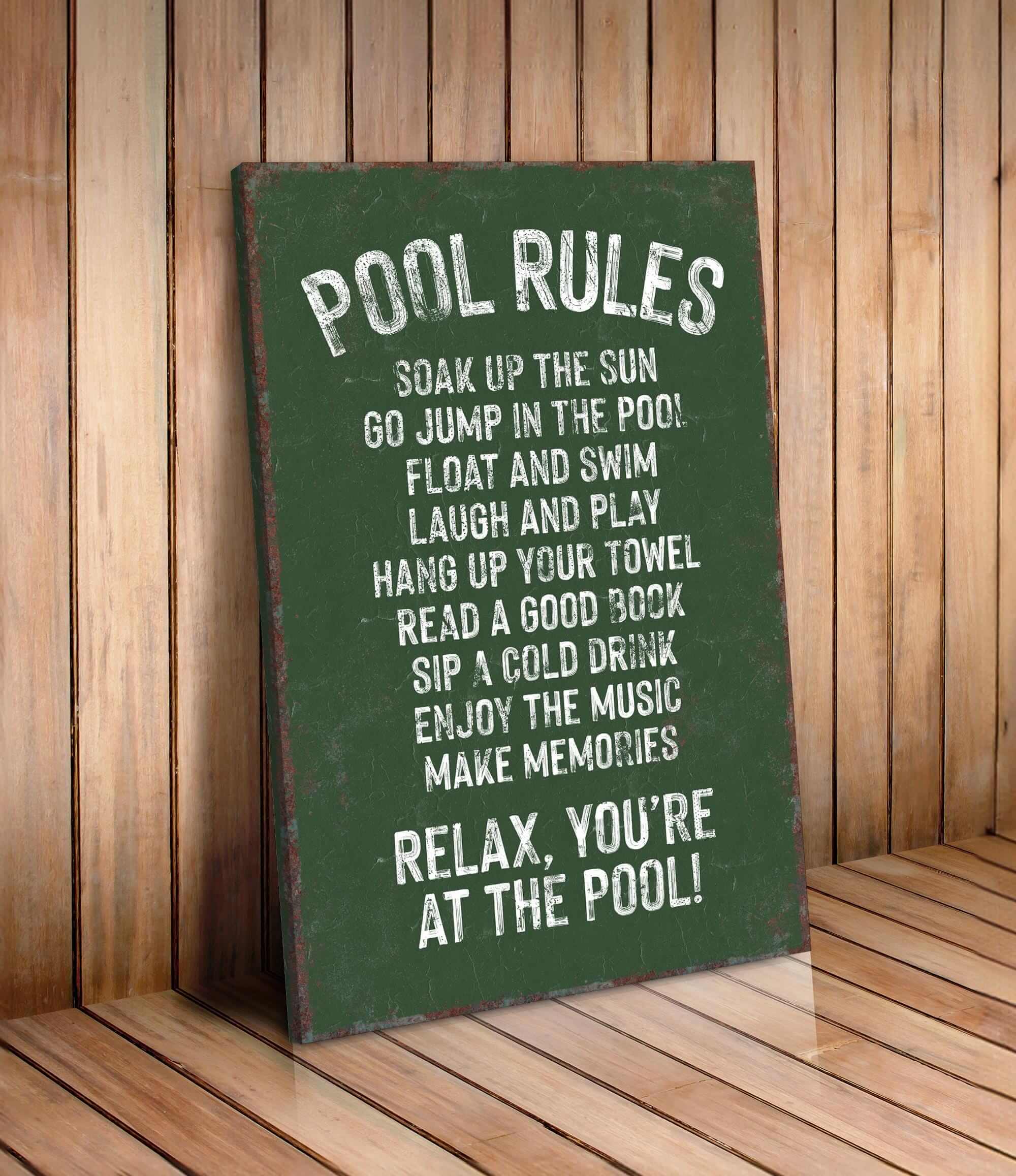 a pool rules sign on a wooden floor
