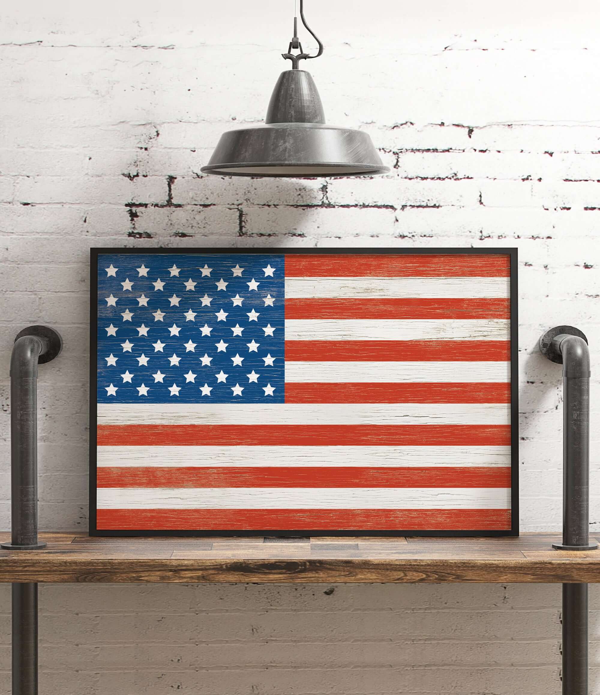 an american flag is hanging on a white brick wall