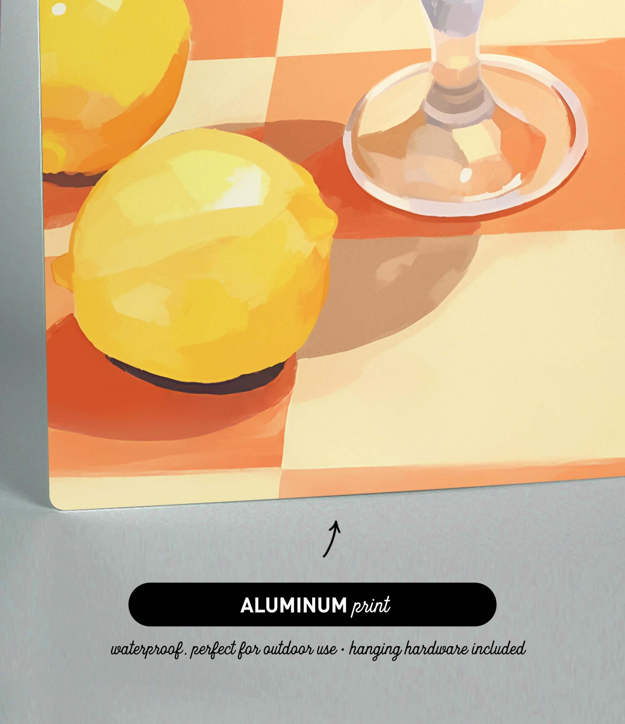 The image is an aluminum print depicting a still life of a lemon and a wine glass on a checkered tablecloth.