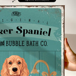 a vintage-style poster with a dog illustration and text, including the words "The Original Baker Spaniel" and "Bubble Bath Co."