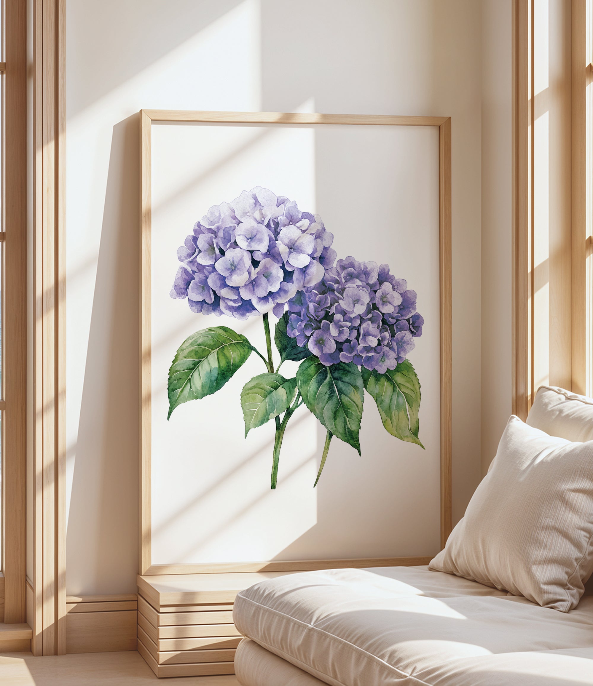 a large framed painting of purple hydrangeas on a white wall, with a wooden frame. The painting is placed in a corner of a room with a white couch and a window, creating a cozy and inviting atmosphere.