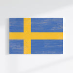 a painting of a yellow and blue flag on a white wall