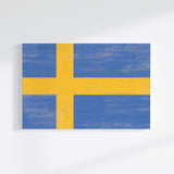 a painting of a yellow and blue flag on a white wall