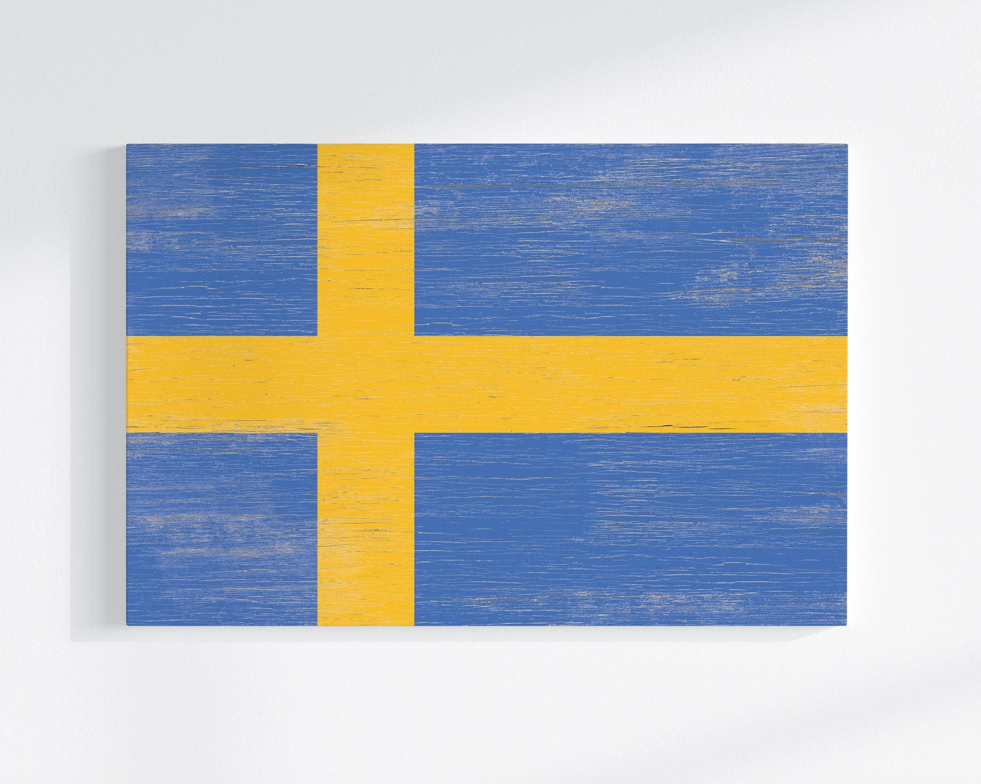 a painting of a yellow and blue flag on a white wall