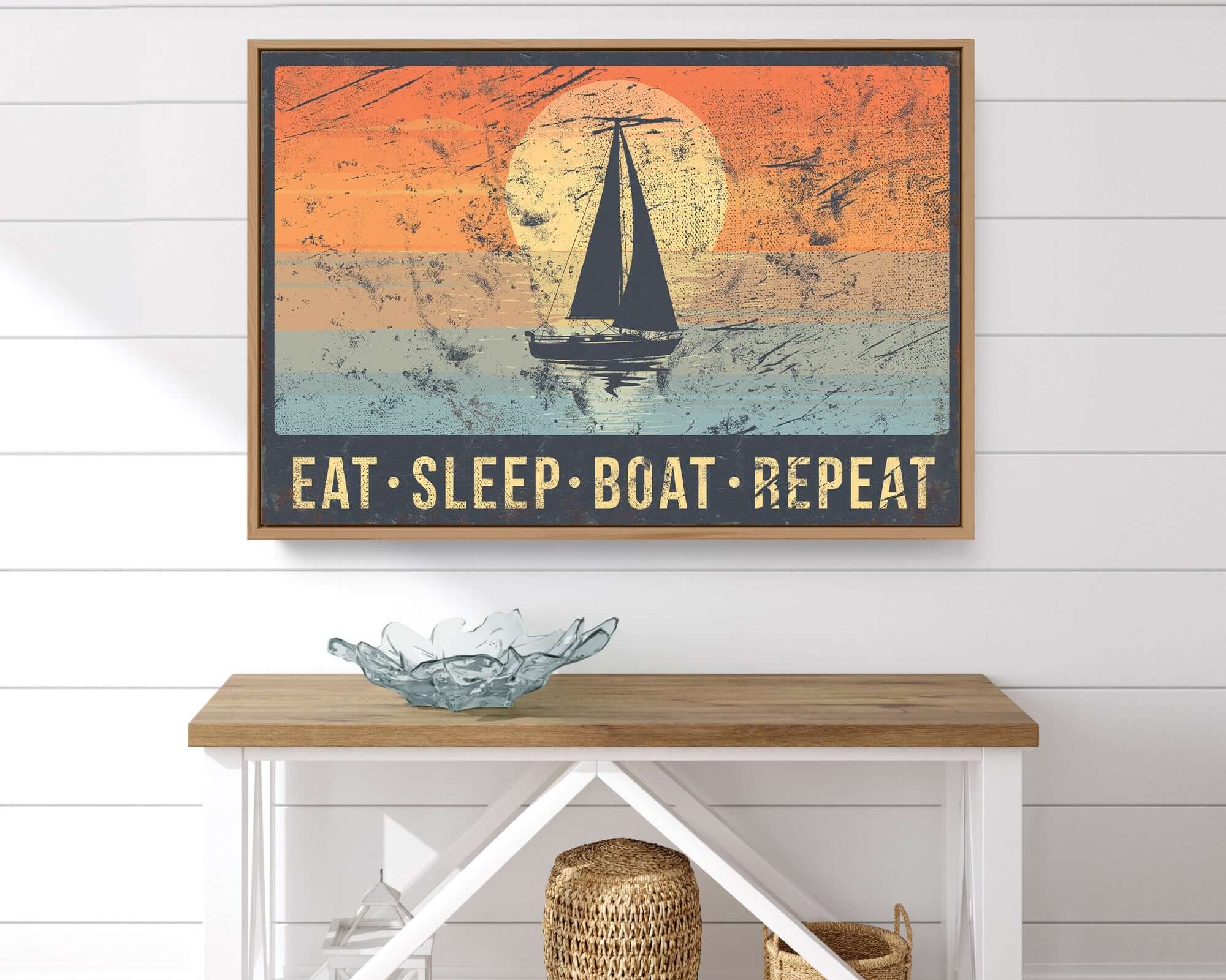 a picture of a boat on a wall above a table