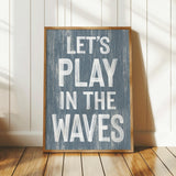 a wooden sign that says let&#39;s play in the waves