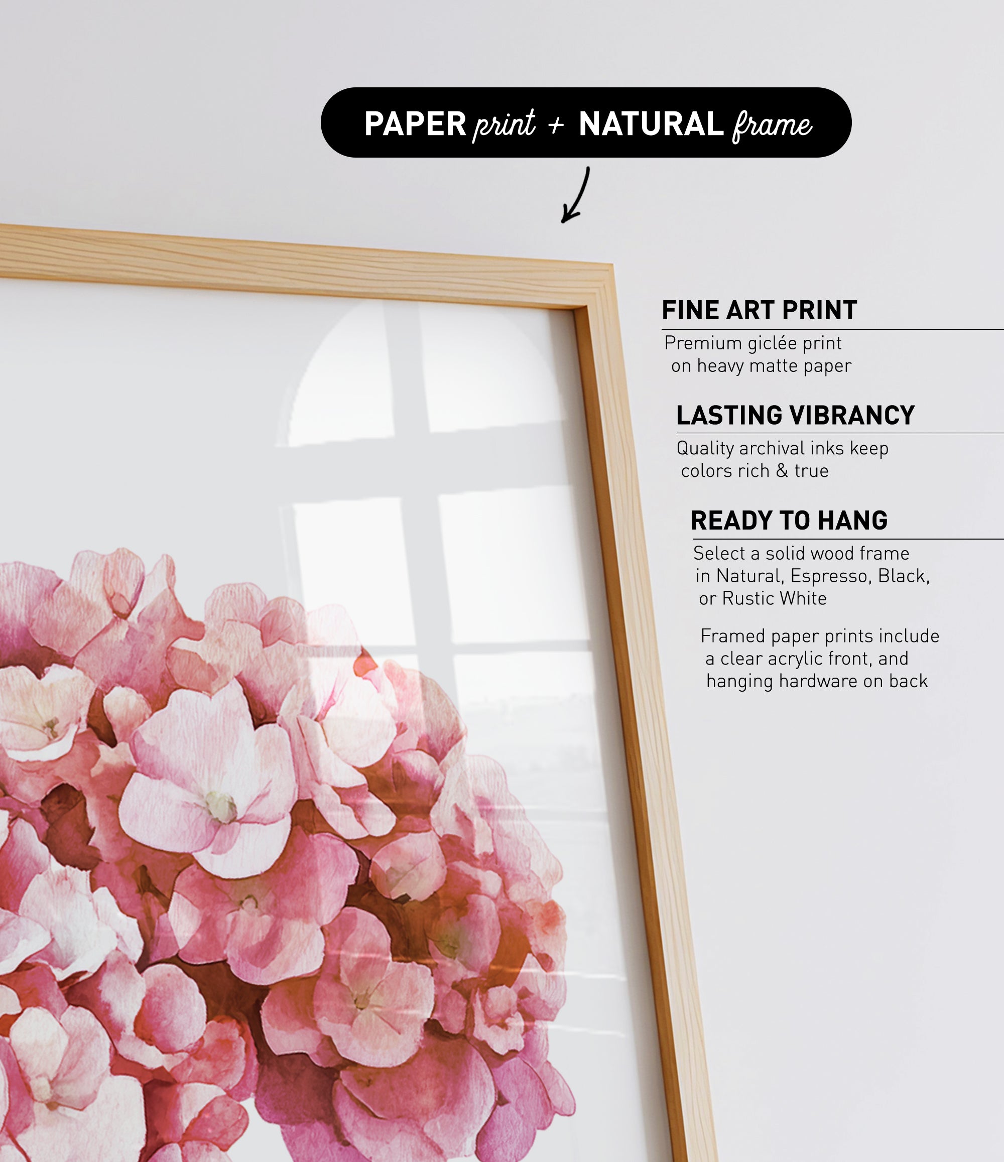 a framed print of a bouquet of pink flowers, with a natural frame.