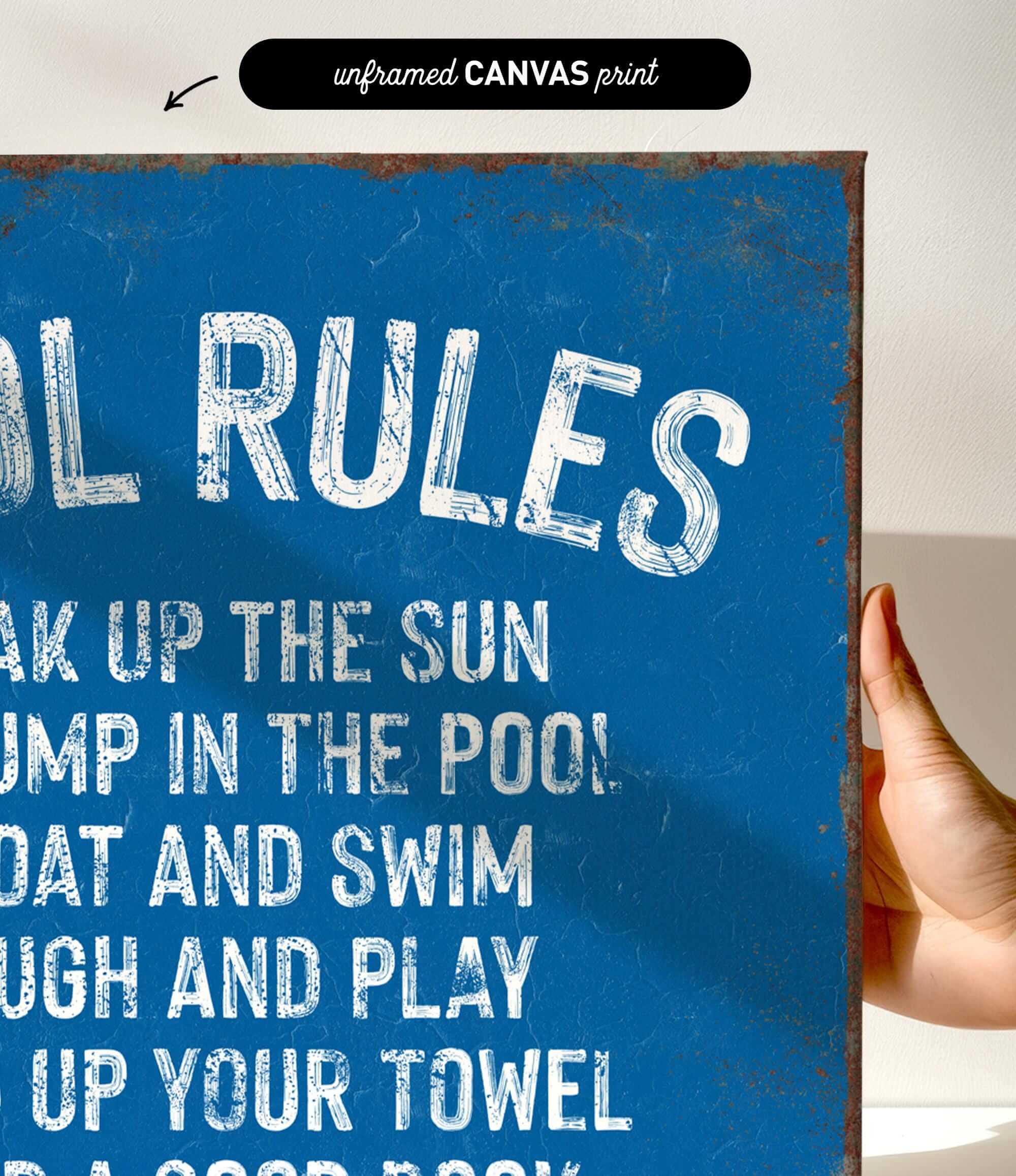 a hand holding a blue sign that says pool rules