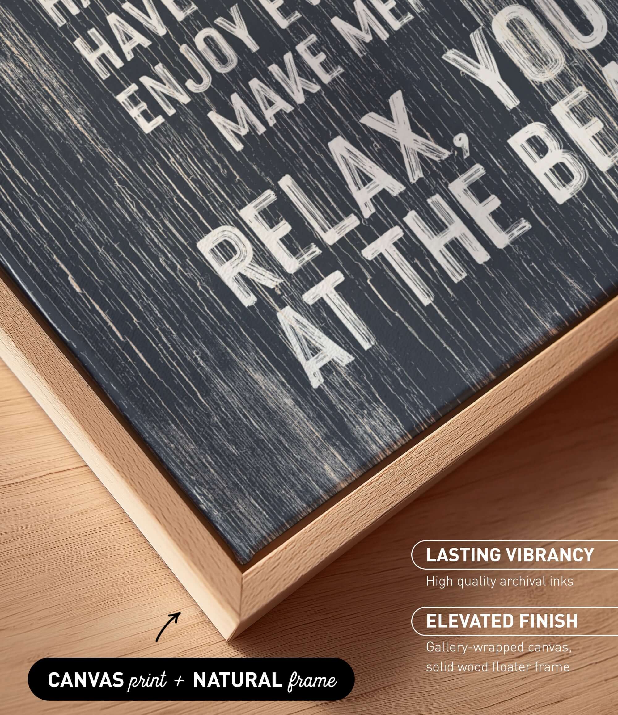 The image is a close-up of a black and white textured canvas print with a wooden frame, placed on a wooden surface.