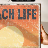 a person holding up a sign that says teach life